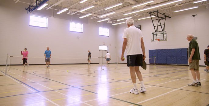 People playing pickleball in the Town Park gym